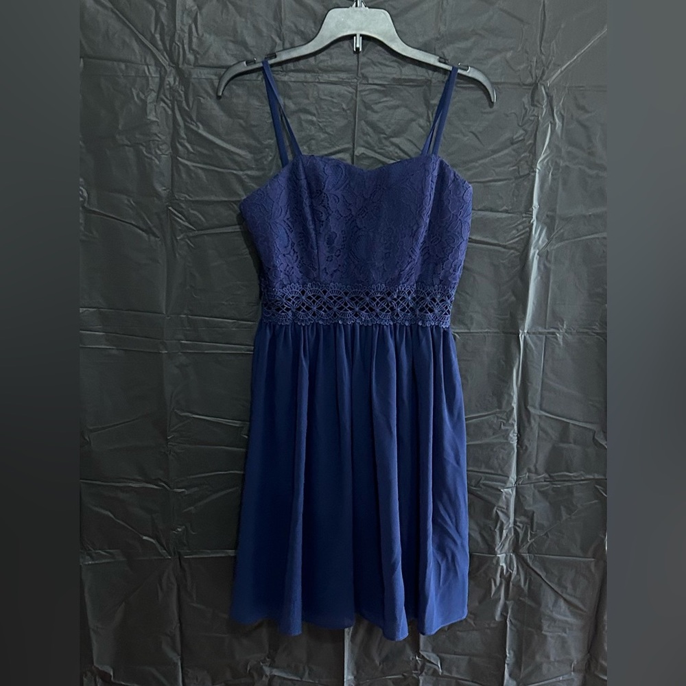 This is a beautiful navy blue dress like new in a size 3